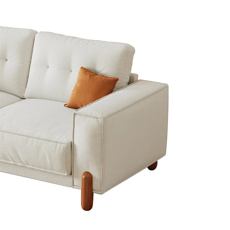 Moderne bank met teddy-stoffen bekleding, houten poten en 2 kussens