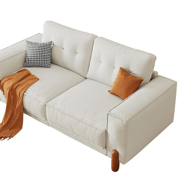 Moderne bank met teddy-stoffen bekleding, houten poten en 2 kussens